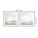 Two framed watercolor prints side by side featuring soft pastel skies and abstract landscape horizons with gentle blues, pinks, and whites.