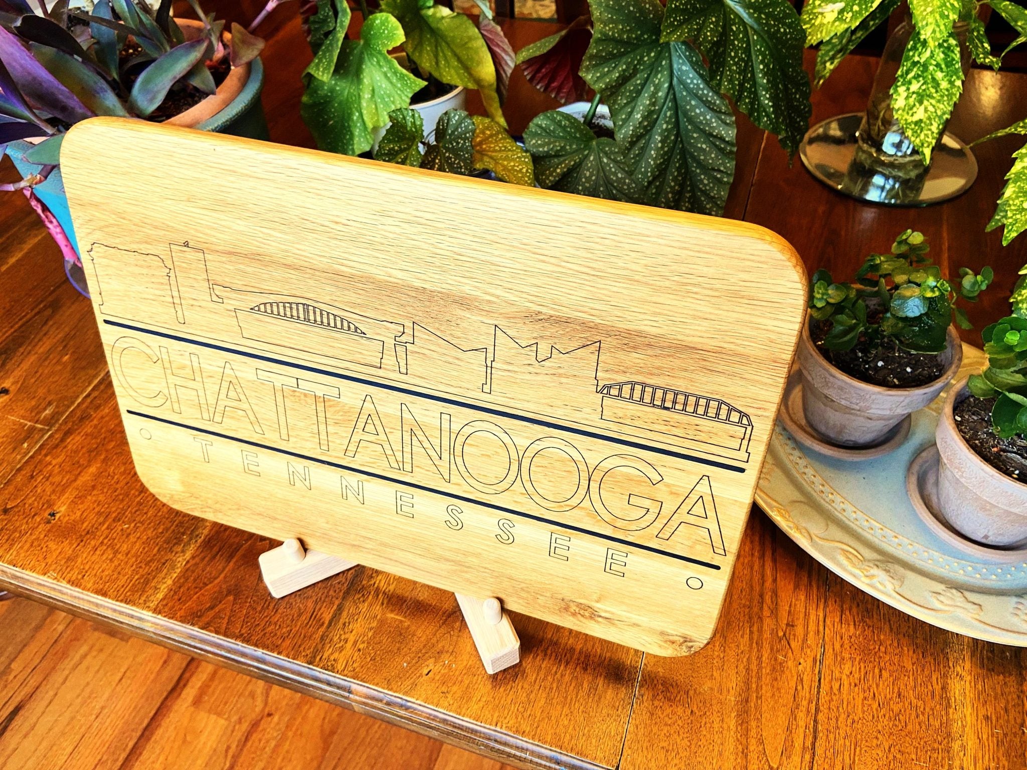 Handmade white oak charcuterie board with engraved Chattanooga skyline