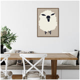 Minimalist framed canvas of a cream-colored sheep with dark face and legs on a beige background, hanging above a wooden dining table with white chairs and a cushioned bench.