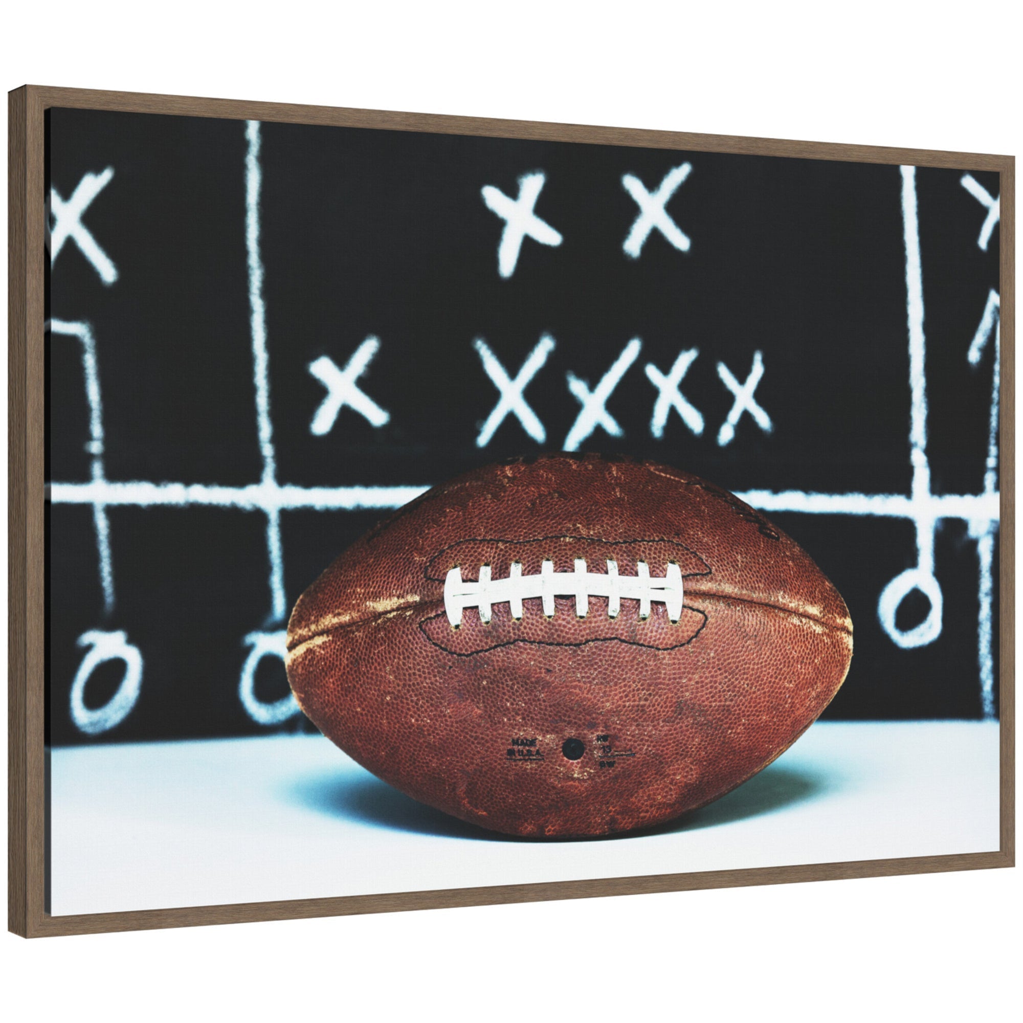 Sylvie Playbook Football framed canvas art showing an artistic football play diagram in white on black background, framed with a slim modern light polystyrene frame.