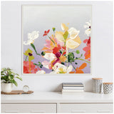 Square canvas painting featuring loosely painted flowers in white, pink, red, and yellow tones against a soft gray background, framed with small bead-like details.