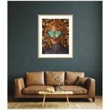 Framed wall art of a woman with curly red hair and teal butterfly wings covering her eyes, set against a dark background with gold floral patterns.