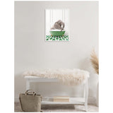 Framed canvas of a baby elephant sitting in a green bathtub against a white paneled wall and green patterned floor, hanging above a white bench with a fur throw.