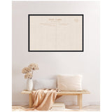 Framed fabric pinboard with linen texture designed as a vintage postcard, hanging above a minimalist wooden bench with neutral pillows and a dried flower vase.