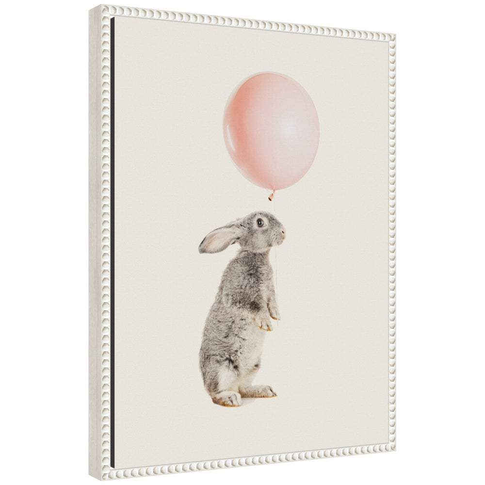 Framed canvas art titled 'Sylvie The Bunny and the Pink Balloon' showing a bunny holding a pink balloon, with a vintage beaded frame