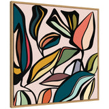 Abstract canvas wall art featuring bold, colorful leaf shapes outlined in black on a pale pink background, framed in light wood.