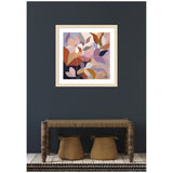 Abstract framed artwork of stylized azure leaves in muted pastel and earthy tones, hung on a dark wall above a rustic wooden bench with two woven baskets underneath.