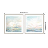 Two framed abstract watercolor prints with soft pastel hues of blue, pink, and green, depicting serene sky and landscape scenes side by side.
