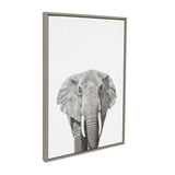 Framed canvas print showing a detailed grayscale front view of an elephant head with prominent tusks against a white background.