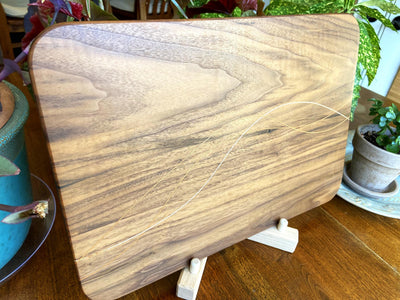 Walnut charcuterie board with Cherry and Maple decorative banding by Fitzgerald Custom Woodcraft
