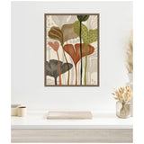 Framed abstract botanical wall art with earth tones including green, brown, rust, and black leaf shapes in soft overlapping patterns on a light background