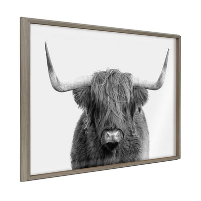 Framed printed art featuring a portrait of a Highland cow with a rustic, natural background
