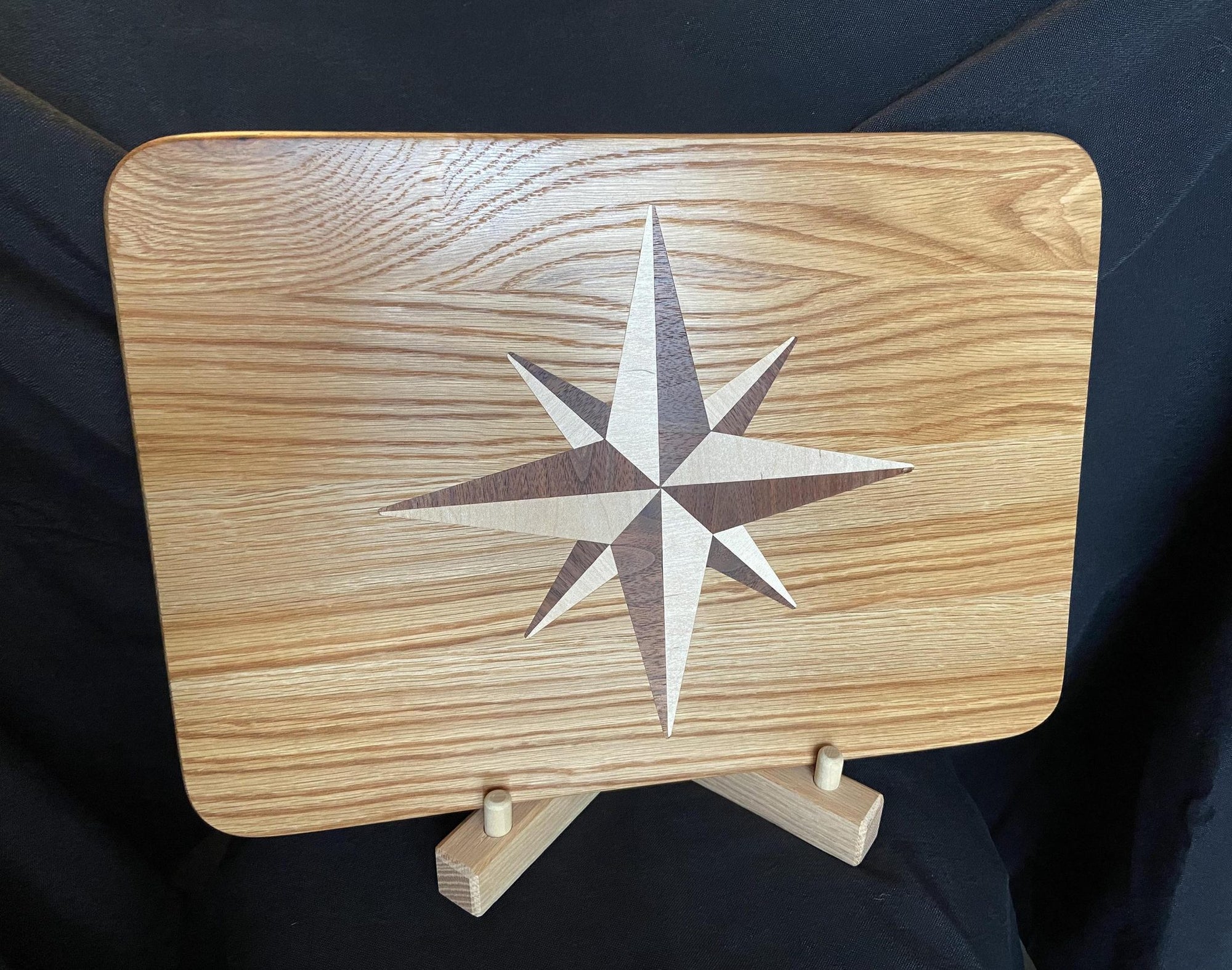 Handcrafted white oak charcuterie board with compass rose inlay