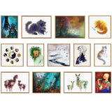 Thirteen framed watercolor paintings arranged in three rows, featuring animals, abstract forms, and nature scenes with soft, blurred edges and warm to cool color palettes.