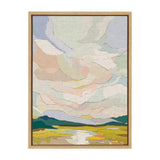 Abstract landscape canvas with pastel clouds over green and yellow fields, framed in natural wood with visible texture on the painted fabric.