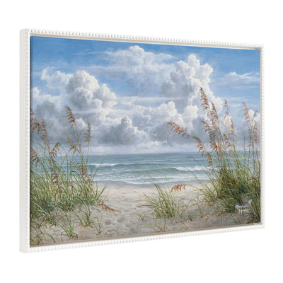 Framed canvas art depicting an ocean beach scene with vintage beaded white frame