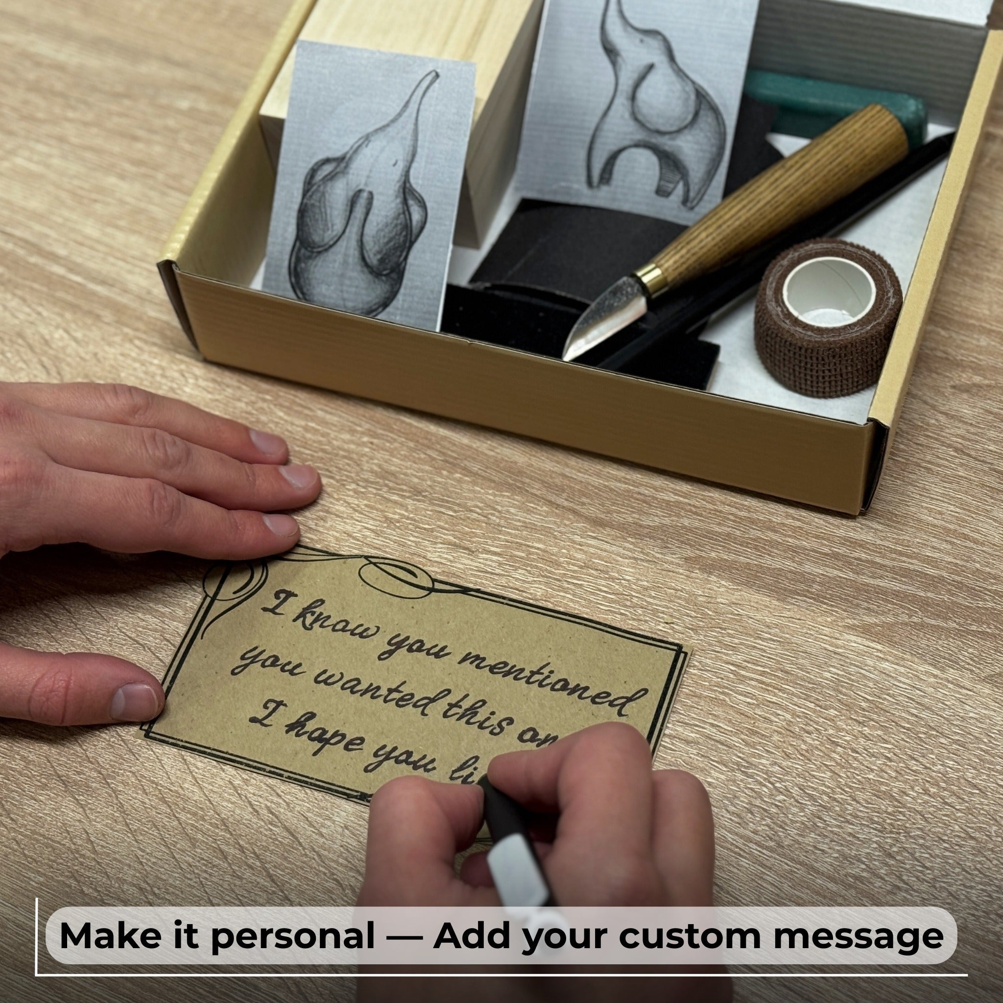 Elephant Carving Kit with hand-forged knife, wood blocks, sandpaper, sharpening board, pencil, and elephant drawing