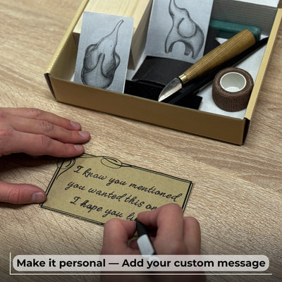 Elephant Carving Kit with hand-forged knife, wood blocks, sandpaper, sharpening board, pencil, and elephant drawing