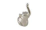 Small silver-finished elephant figurine with raised trunk and smooth, rounded body, featuring minimal detailing on ears and eyes.