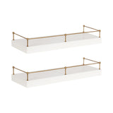 Two white rectangular floating shelves with slim gold railings featuring spherical finials along the edges, shown against a white background.