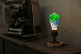 EP Light Spring Resin LED Bulb with green resin design on wooden base