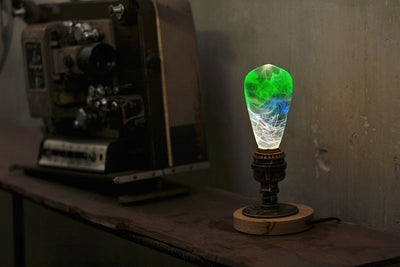 EP Light Spring Resin LED Bulb with green resin design on wooden base
