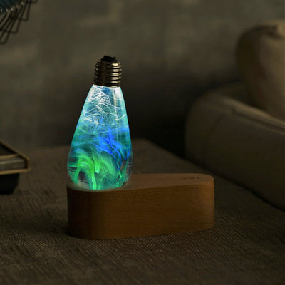 EP Light Spring Resin LED Bulb with green resin design on wooden base