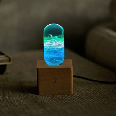 Three handcrafted resin LED bulbs with unique color patterns, shown in a 3-pack