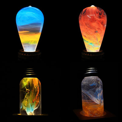 EP Light 4-Pack Resin LED Bulb Bundle showing Fire, Nebula, Youth, and Sunrise bulbs with wood base