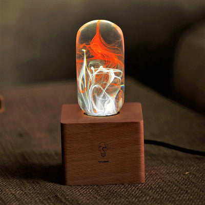 EP Light 4-Pack Resin LED Bulb Bundle showing four handcrafted resin LED bulbs and wooden base