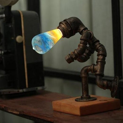 EP Light Fire Decorative Resin LED Bulb with glowing fire effect inside, shown with wooden base options