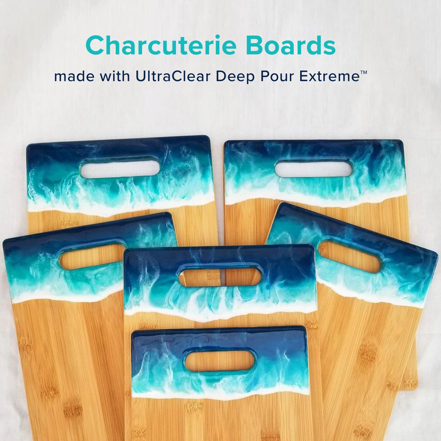 Set of charcuterie boards with blue and white wave design on a light gray background