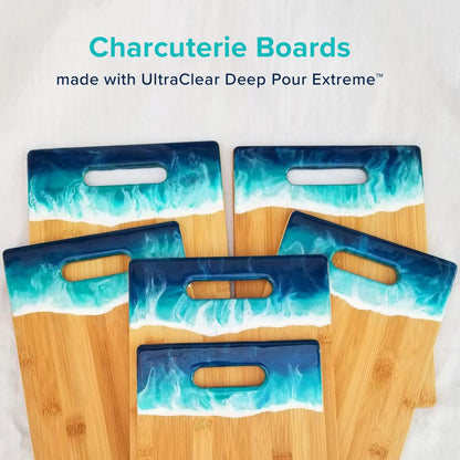 Set of charcuterie boards with blue and white wave design on a light gray background