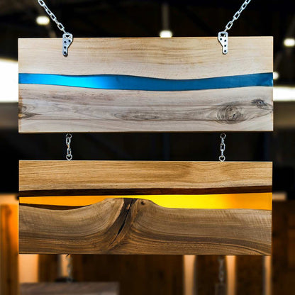 Wooden sign with blue and gold stripes on a blurred background