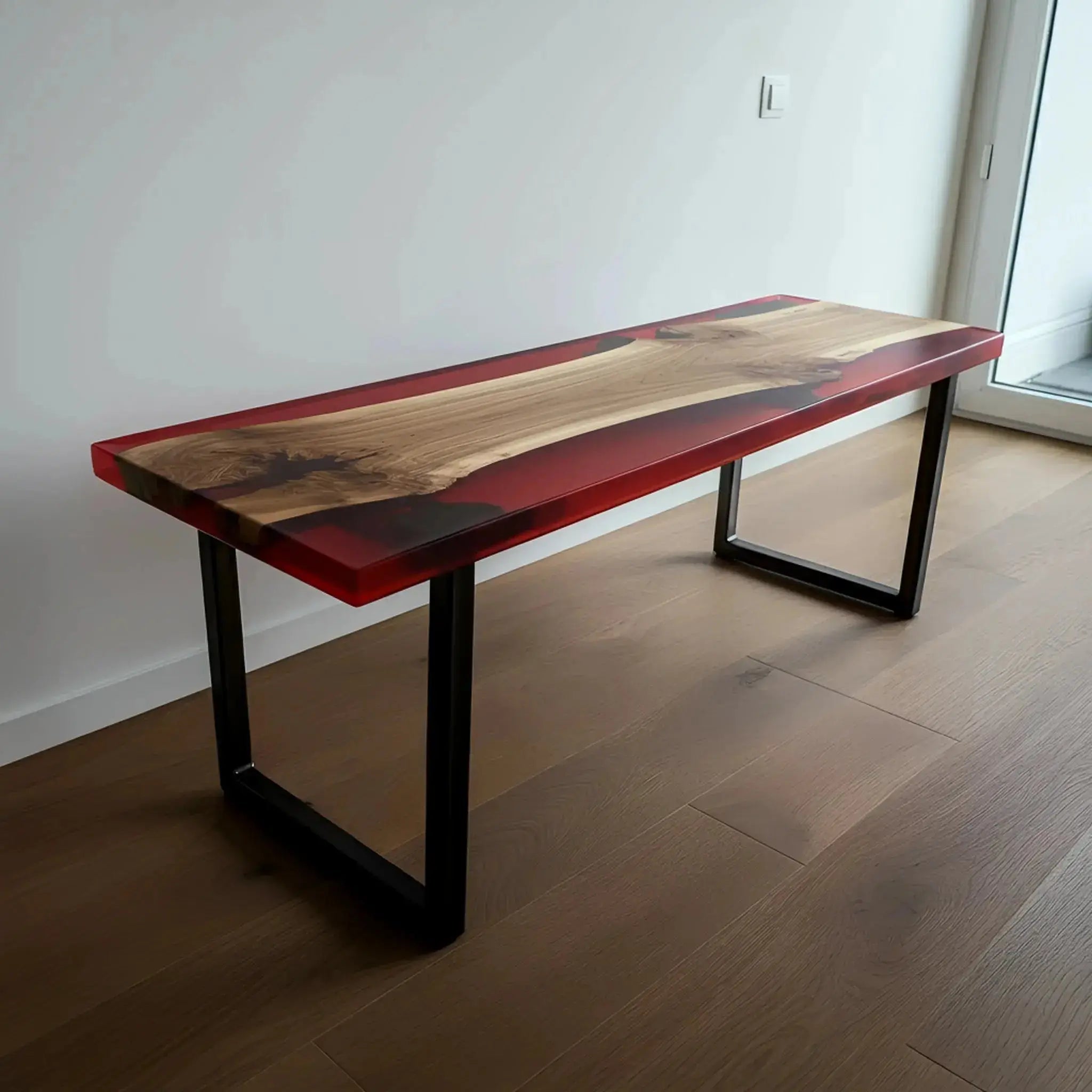 Walnut and red resin epoxy dining bench with modern black legs, placed in a minimalist interior. Custom handmade furniture for kitchen or dining rooms.
