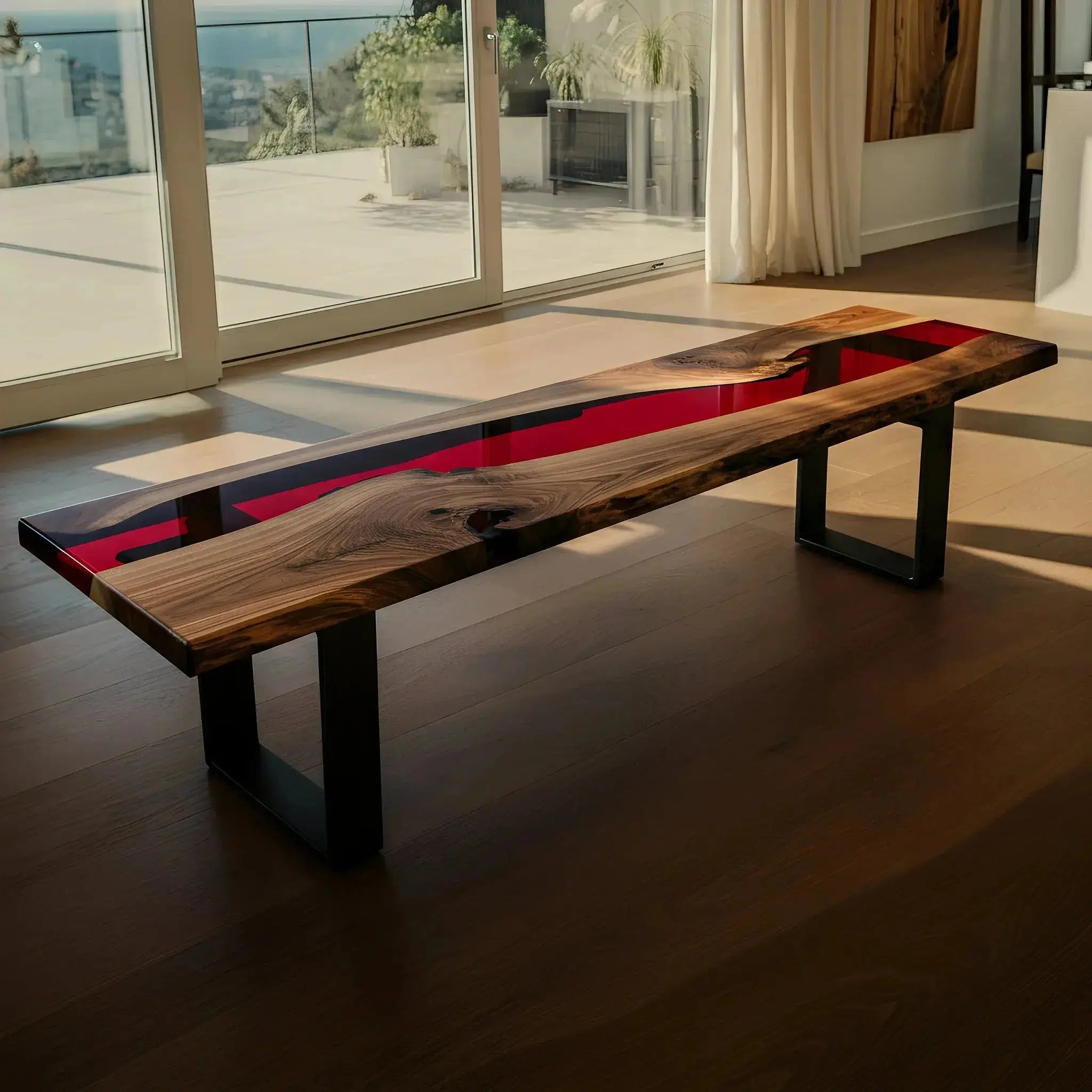 Custom handmade epoxy bench with walnut wood and red resin, styled in a bright living area. Perfect for dining or entryway seating.