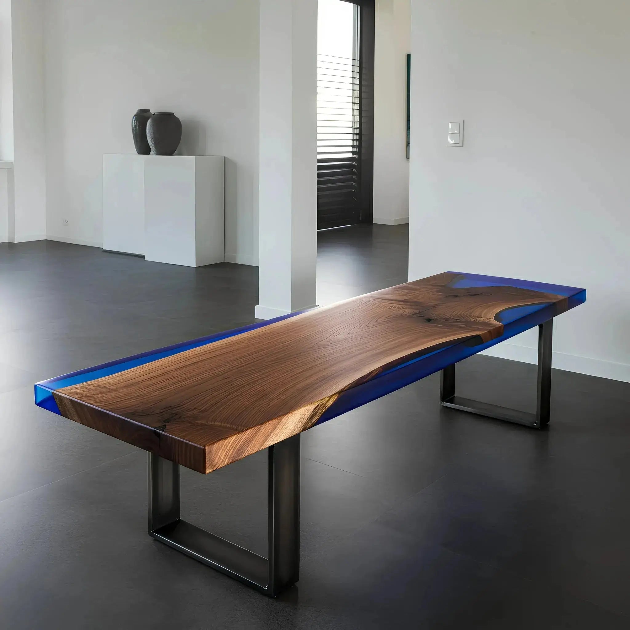 Walnut and blue resin epoxy bench in a minimalist dining space. Custom handmade USA furniture supporting marine conservation.