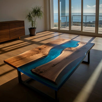 Epoxy river coffee table with flowing deep blue resin and live edge walnut, set in a sunlit modern living room. Handmade in the USA.