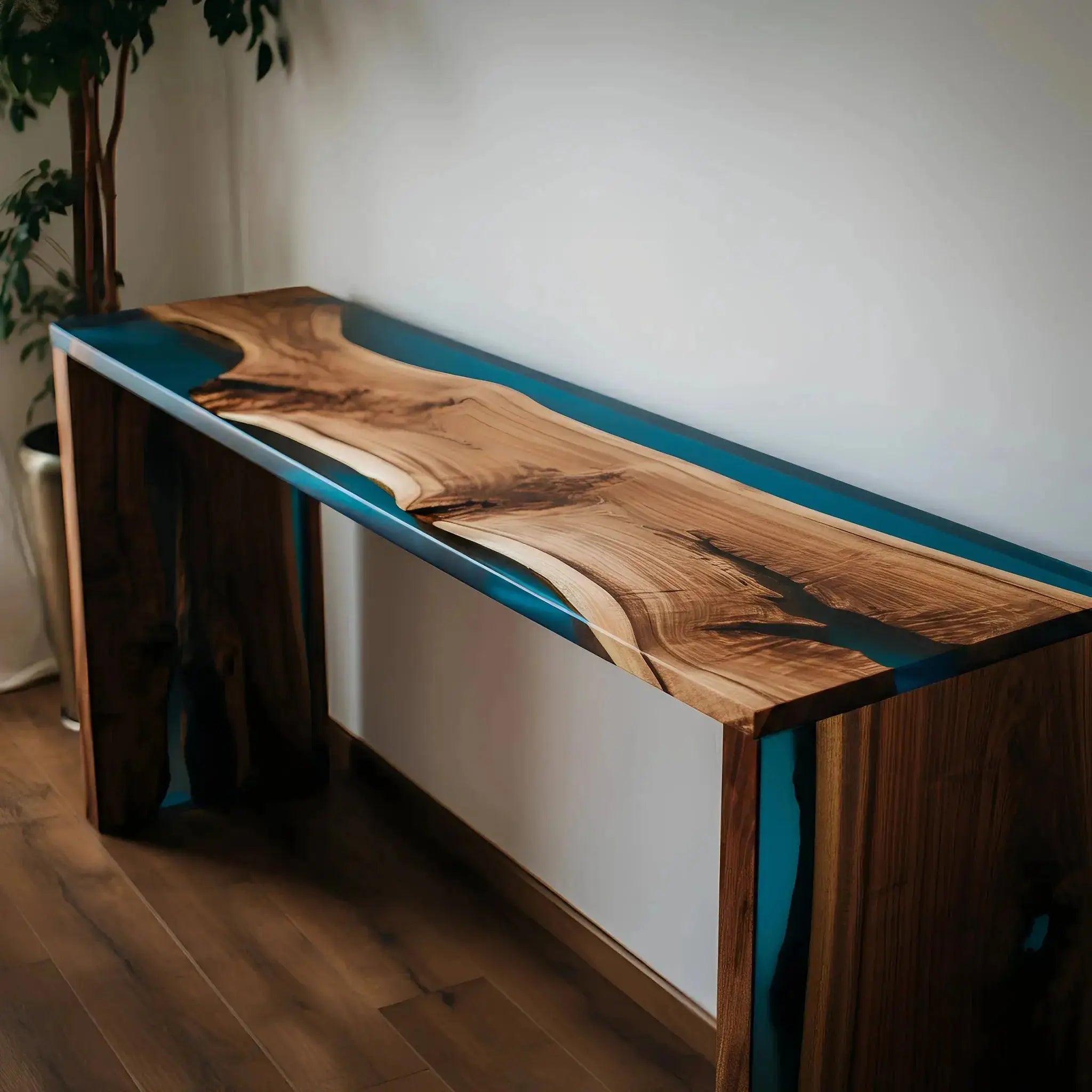 Artisan epoxy river console table with natural walnut slabs and ocean-blue resin, designed for stylish dining or living room settings.