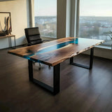 Handmade epoxy river office desk with walnut wood and blue resin, featuring metal legs and a sleek finish in a modern home office.