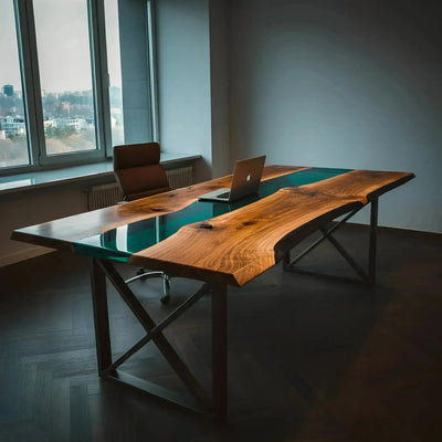 Handcrafted walnut wood office desk with green epoxy resin accents and black metal legs, modern design in a bright workspace.