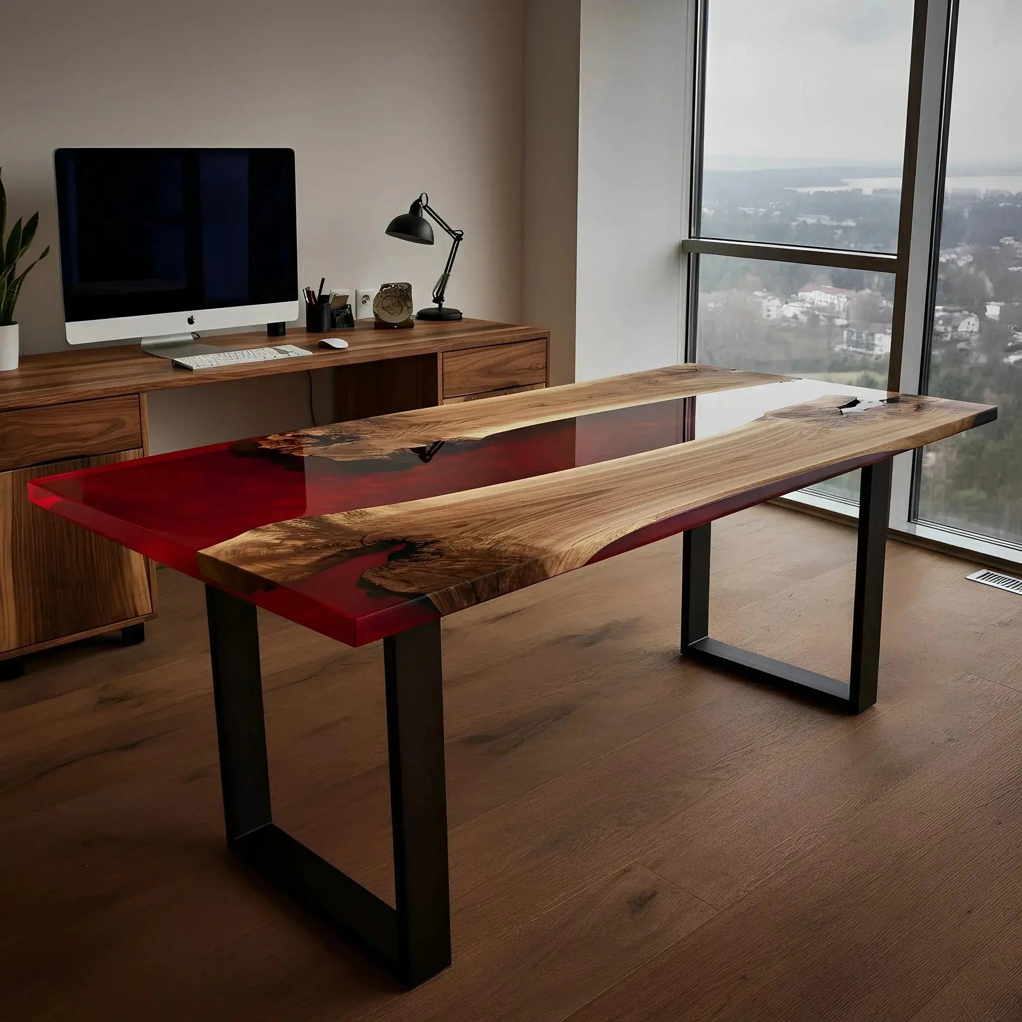 Handmade walnut and red resin epoxy river desk in a corner office. Premium office furniture supporting bird habitat preservation.