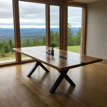 Walnut and black resin custom epoxy dining table with X-shaped metal legs, placed in a minimalist room with panoramic mountain views.