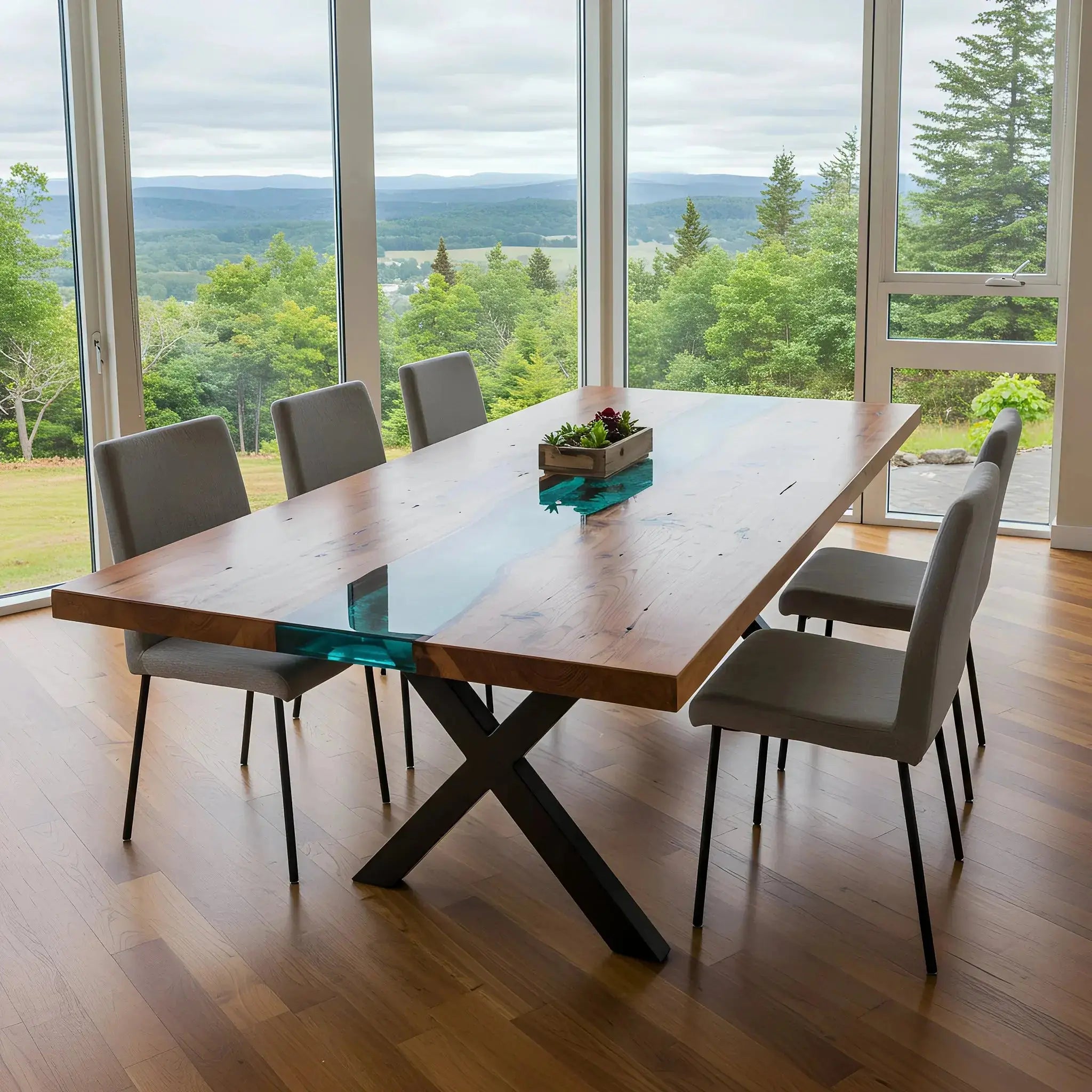 Custom epoxy ocean dining table with walnut top and blue resin centerpiece, paired with gray chairs in a bright, scenic dining space.