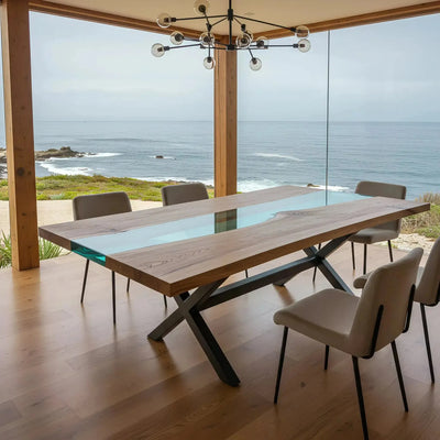 Custom epoxy ocean dining table with walnut wood and blue resin river, handmade in the USA with modern metal X-leg base