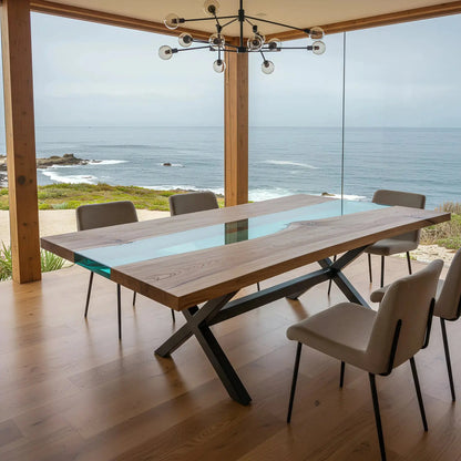 Blue Odyssey Dining Table with ocean-inspired epoxy resin and walnut wood, set in a minimalist coastal home with floor-to-ceiling windows.