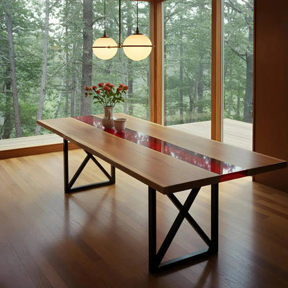 Handmade walnut and red resin epoxy river dining table in a modern wood-paneled room. Custom USA-crafted furniture for elegant dining spaces.