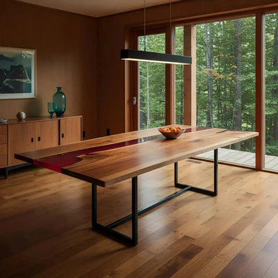 Custom epoxy river dining table with walnut wood and red resin, featuring cardinal bird accents. Handmade in the USA for nature-inspired interiors.