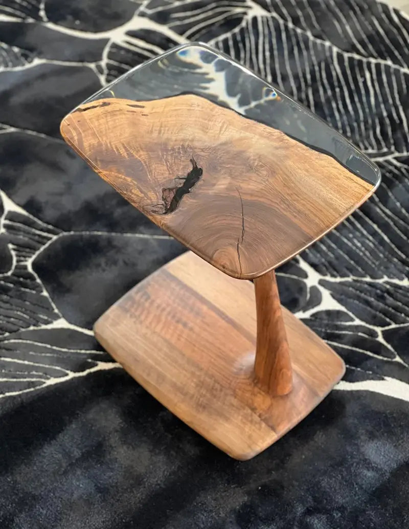 C-shaped luxury resin end table made of solid walnut wood with clear epoxy resin finish