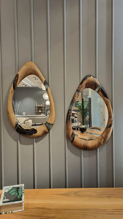 Handcrafted epoxy resin and walnut mirrors in round and teardrop shapes
